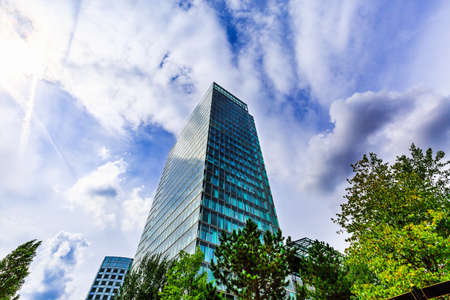 Modern office building exterior design, glass facade.