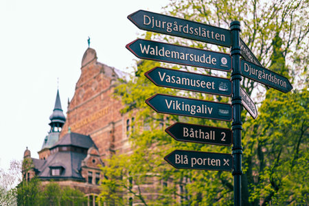 Metallic signpost on island Djurgarden in Stockholm, Sweden. Street sign indicating directions to landmarks, different museums and popular places. The Nordic Museumのeditorial素材