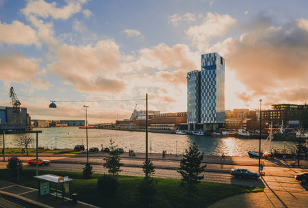 Helsinki, Finland - November 4, 2018: Aerial view of city street at colorful sunset. Scenic panorama of embankment of sea port Helsinki West harbor in autumn sunlights.のeditorial素材