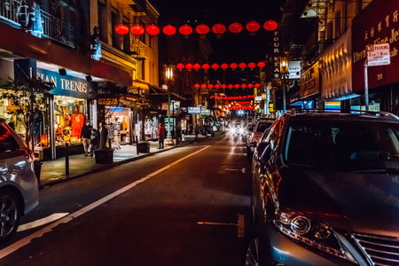 San Francisco, USA - January 19, 2020: Chinese New Year lanterns. City streetlights in Chinatown at night. Exterior Asian buildings on Grant Avenue, California.のeditorial素材