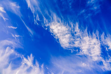 Amazing blue sky with white fluffy clouds. Natural background.の写真素材