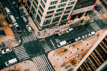 New York, USA - February 10, 2020: Famous Wall Street financial landmark in Lower Manhattan. Looking down at high-rise glass skyscrapers, pedestrian people, transport parked in row. Scenic Big apple.のeditorial素材