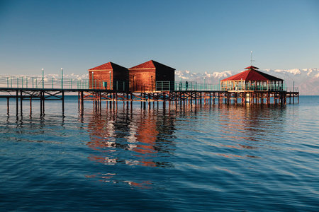 Issyk-Kul Lake, Kyrgyzstan. Snowcapped Terskey Ala-Too (Terskey Alatau) Mountain Range. Asian tourism destination.の写真素材