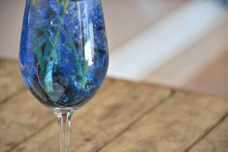 Blue Science soil jelly in wine glassの写真素材