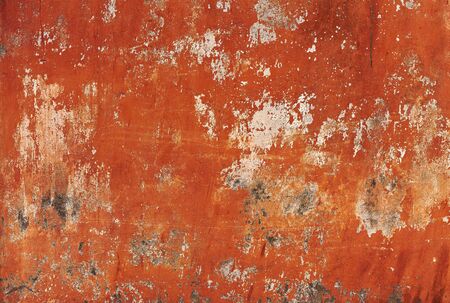 Dirty wall with broken cement plaster. Vintage surface texture. Rought painted wall background.の写真素材