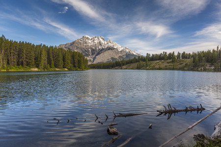 Johnson Lake with Mountains and Boreal Forest in Background - Banff National Park, Alberta, Canadaの写真素材