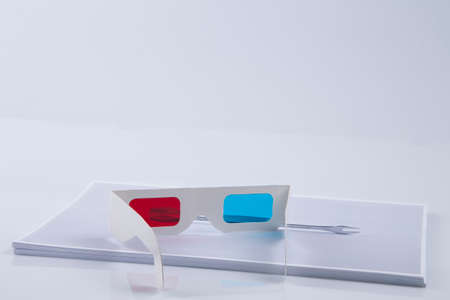 3D Print  white 3D anaglyphic Red Blue glasses and paper printed wrenchの写真素材