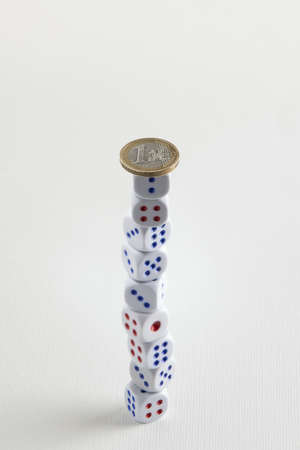 euro coin on dice stackの写真素材