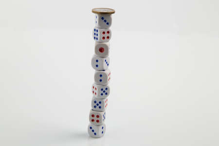 Euro coin on stack of dice