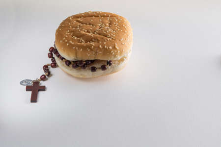 Fast food bread and Holy Rosary beads necklace
