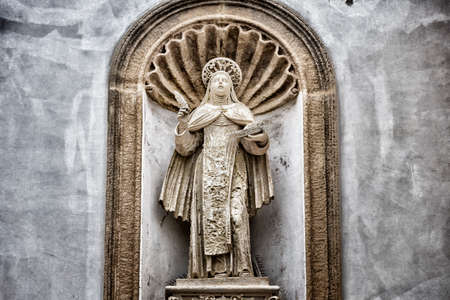 St. Therese of Lisieux statue on the facade of the church and convent of Carmelitane Scalze  in the old town of Gallipoli (Le)の写真素材