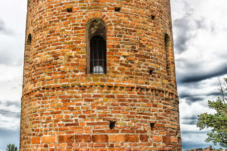 Cylindrical bell tower  (VIII-IX centuries) of countryside church of Campanile, located in the village of Santa Maria in Fabriago in Emilia Romagna region in northern Italyの写真素材