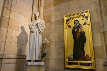 Statue of Jesus Christ and painting of Saint Agnes of Bohemia inside Saint Vitus Dome in Prague