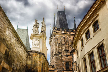 Architecture details, tower and sculpture of Charles Bridge in Pragueの写真素材
