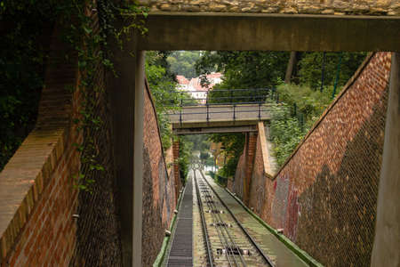 The full working funicular of Petrin Hill in Prague: cable railway and brick wallsの写真素材