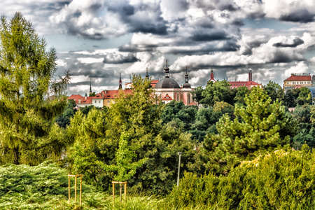 Scenic view of the historical center of Prague: houses, buildings, palaces, landmarks of old town with the characteristic and picturesque red rooftops and multi-coloured walls.の写真素材