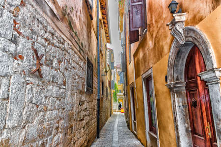 Typical istrian architecture: walls, houses, windows, stones and streets of Porec in Croatiaの写真素材