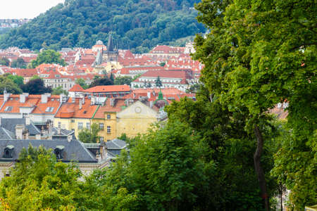 Scenic view of bridges on the Vltava river and of the historical center of Prague: buildings and landmarks of old town with red rooftops and multi-coloured walls.の写真素材