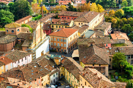A foggy view over the medieval country village of Brisighella in Emilia Romagna, Italy, from the medieval Fortress of Venetiansのeditorial素材