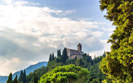 Sanctuary of the Blessed Virgin of Monticino surrounded by cypress trees, in Brisighella in Italy.  View from the medieval Fortress of Venetiansのeditorial素材