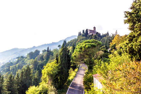 Sanctuary of the Blessed Virgin of Monticino surrounded by cypress trees, in Brisighella in Italy.  View from the medieval Fortress of Venetiansのeditorial素材