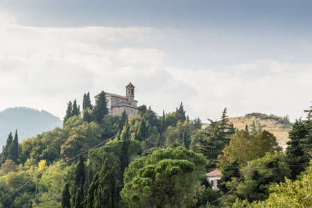 Sanctuary of the Blessed Virgin of Monticino surrounded by cypress trees, in Brisighella in Italy.  View from the medieval Fortress of Venetiansのeditorial素材