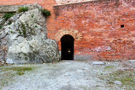 Door entry in the brickwalls of the medieval Fortress of Venetians in Brisighellaのeditorial素材