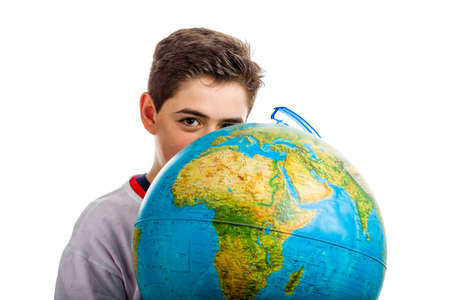 A Caucasian boy hidden a globe reveals only the eyes and part of the faceの写真素材