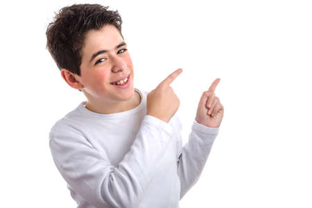 Caucasian young smooth-skinned boy in a white long sleeve t-shirt double pointing up to his left side with both forefingersの写真素材