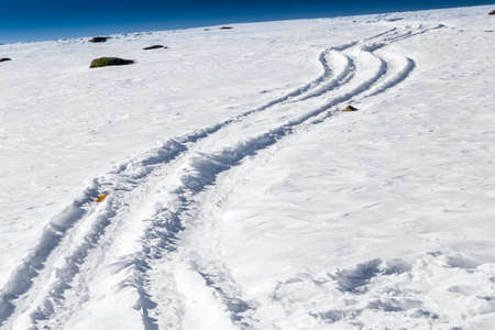 Trails on fresh snow on Dolomites Alpsの写真素材