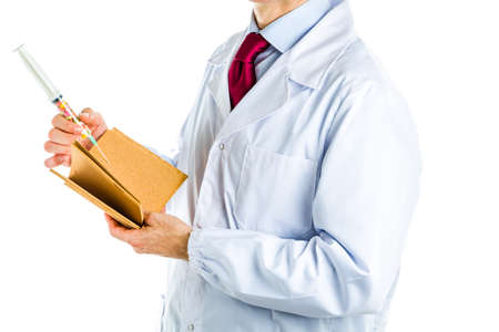 Caucasian male doctor dressed in white coat, blue shirt and red tie is holding a blank cork book and...