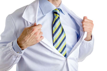 Man dressed with medical white coat, light blue shirt and glossy regimental tie with dark blue, light blue and green stripes, is undressing as a superheroの写真素材