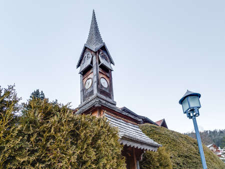 Old clock in small wooden tower in Dolomites villageの写真素材