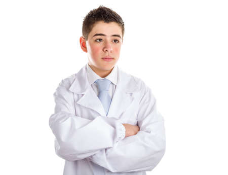 A child doctor crossing arms helps to feel medicine more friendly. No photo retouching on skinの写真素材