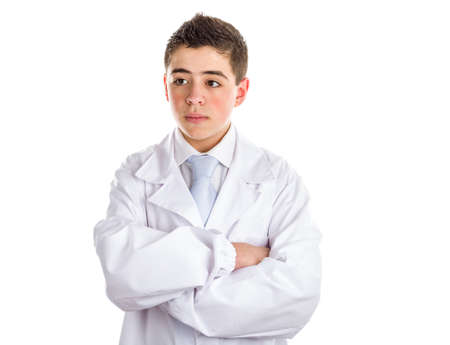 A child doctor crossing arms helps to feel medicine more friendly. No photo retouching on skinの写真素材