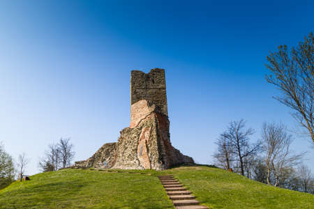 historic feeling comes out of Ruins of medieval fortress, Rocca di Monte Battaglia, on hills in the countryside in Italyの写真素材