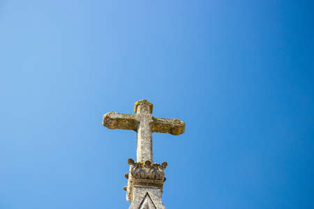 Stone crucifix in the skyの写真素材