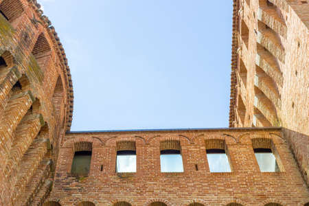 The deep sense of history points out this military fortification of 1400 in Northern Italy in Emilia Romagna, in the centre of the small old country village of Riolo Terme.の写真素材