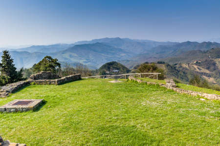 historic feeling comes out of Ruins of medieval fortress, Rocca di Monte Battaglia, on hills in the countryside in Italyの写真素材