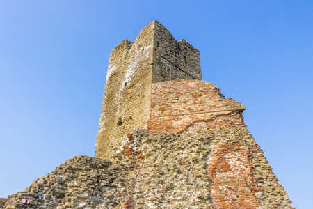 historic feeling comes out of Ruins of medieval fortress, Rocca di Monte Battaglia, on hills in the countryside in Italyの写真素材