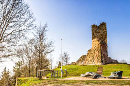 historic feeling comes out of Ruins of medieval fortress, Rocca di Monte Battaglia, on hills in the countryside in Italyの写真素材