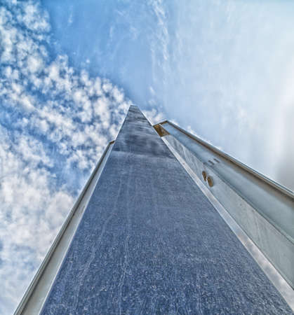 A long steel and iron tip going to vanishing point at the horizon on a sky backgroundの写真素材