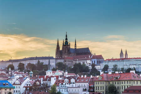 View of Praga Castle and Saint Vitus Cathedral overlooking the red rooftops of Pragueのeditorial素材