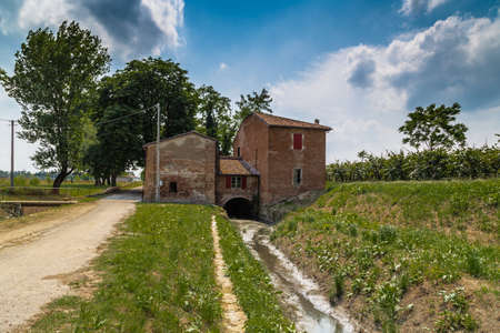 Ruins of 15th century country mill, Molino di Scodellino, rustic building made of brick and still...