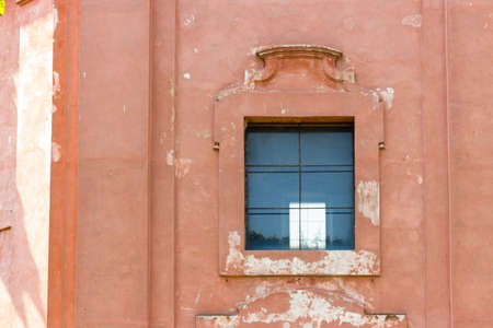 Window of the rigid and severe architecture of the Shrine of Our Lady of Health of Solarolo in Italy, church from the 18th century devoted to the Blessed Virgin Maryのeditorial素材