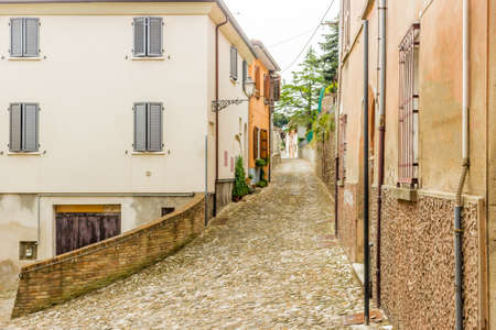 medieval streets and ancient memories - the maze of alleys of a medieval village in Italy, between historical buildings and private homesの写真素材