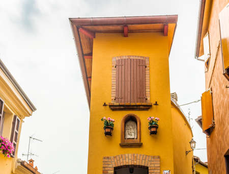 medieval streets and ancient memories - the maze of alleys of a medieval village in Italy, between historical buildings and private homesの写真素材