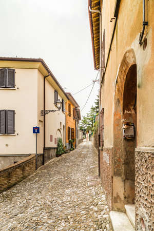 medieval streets and ancient memories - the maze of alleys of a medieval village in Italy, between historical buildings and private homesの写真素材
