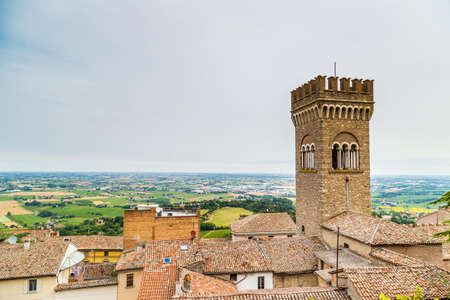 architecture in the Middle Ages - the civic tower adjacent to the town hall of bertinoro with its characteristic brick wallsの写真素材