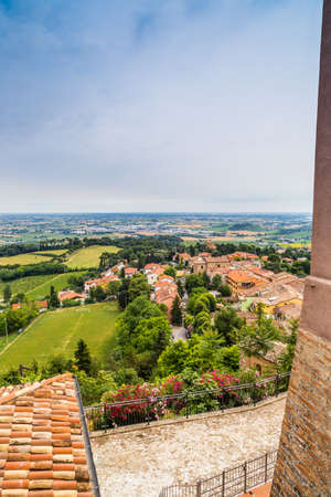nature and memories - view from the terrace of the medieval village of bertinoro in Italy overlooking the hills of the Romagna countryside sloping down to the seaの写真素材